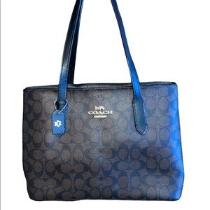 Coach tote with middle zipper compartment